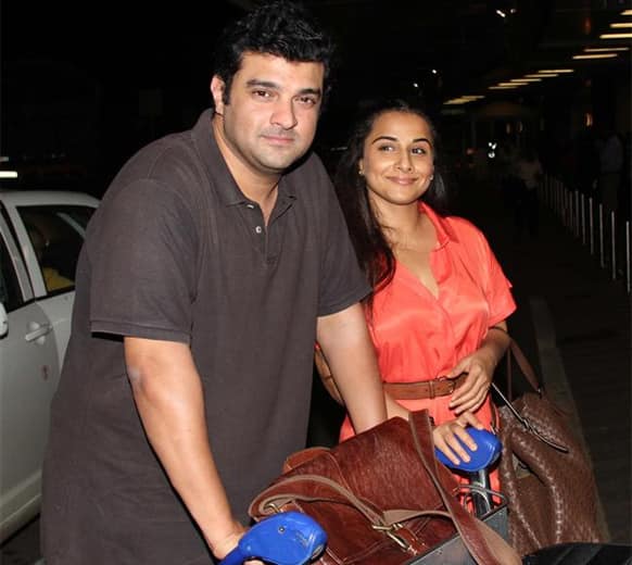 Sidharth Roy Kapur and Vidya Balan were spotted leaving for IIFA 2013.