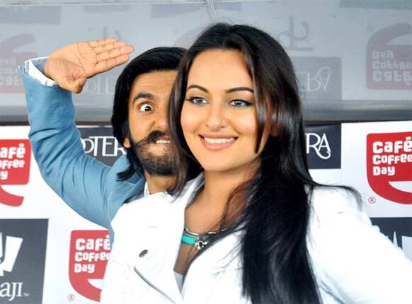 Ranveer Singh strikes an epic pose as Sonakshi Sinha smiles away at the crowd.