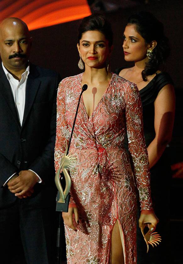 Bollywood actor Deepika Padukone receives the Best Jodi of The Year award during the International Indian Film Academy (IIFA) awards in Macau.