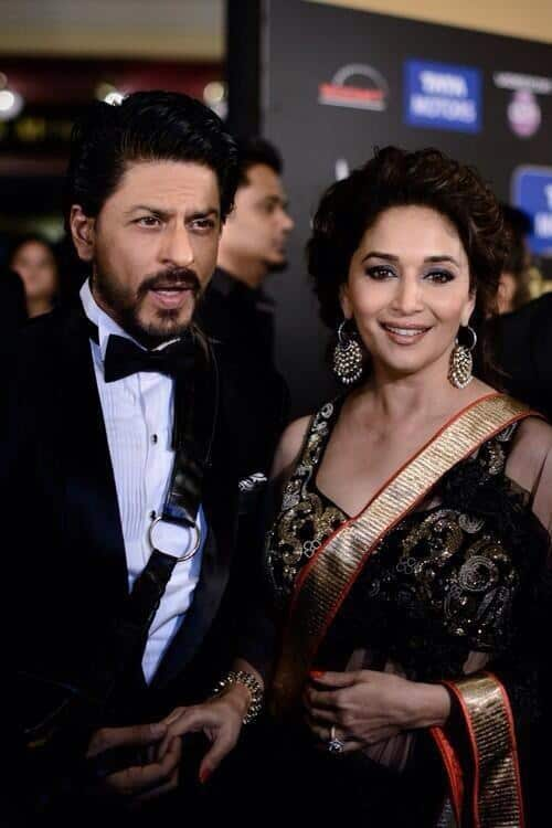 Madhuri Dixit tweeted this picture with Shah Rukh Khan accompanied by the tweet “Amazing hanging out with @iamsrk  at #IIFA ! RT if u agree!”