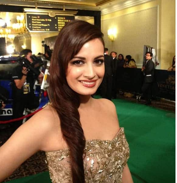 Dia Mirza all decked in a golden outfit.