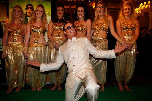 Hollywood actor Jean-Claude Van Damme arrives for the International Indian Film Academy (IIFA) awards in Macau, Saturday, July 6, 2013. 