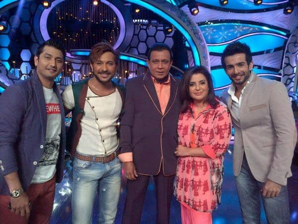 The members of the jury pose for a picture with the hosts on the sets of a dance reality show.