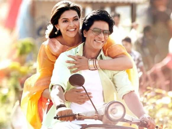 SRK drives the scooter and Deepika rides the pillion.