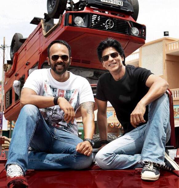 Shah Rukh Khan sat down with director Rohit Shetty to pose for a candid picture on the sets of 'Chennai Express'.