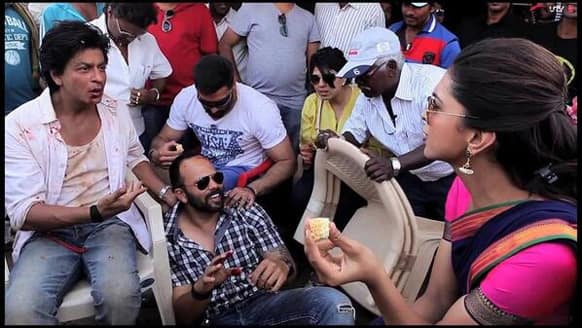 Shah Rukh Khan and Rohit Shetty in conversation with Deepika Padukone on the sets of 'Chennai Express'.