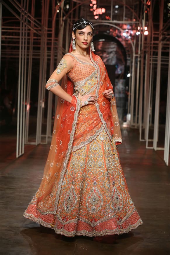 Model Indrani Dasgupta displays Tarun Tahiliani's bridal wear at the India Bridal Fashion Week 2013.