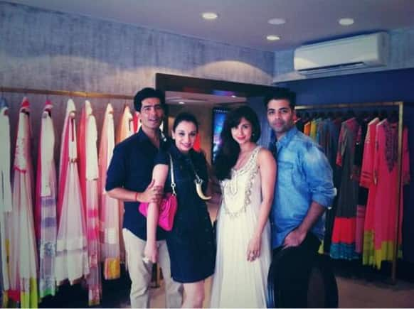 Manish Malhotra with his friends Urmila Matondkar and Karan Johar at the opening of his new store.