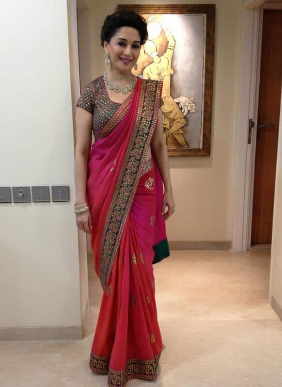 Madhuri Dixit poses for the camera, before she heads towards a store launch.                     Pic Courtesy: @MadhuriDixit1