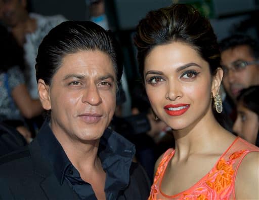 Shah Rukh Khan and Deepika Padukone attend the UK Premiere of Chennai Express at a cinema in Feltham, England.