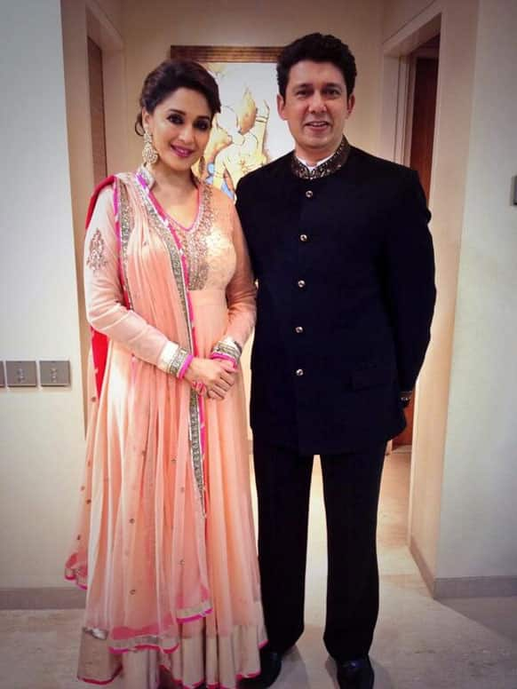 Madhuri Dixit Nene and  Dr Shriram Madhav Nene on their way to Shah Rukh Khan's Eid Part, @MadhuriDixit1