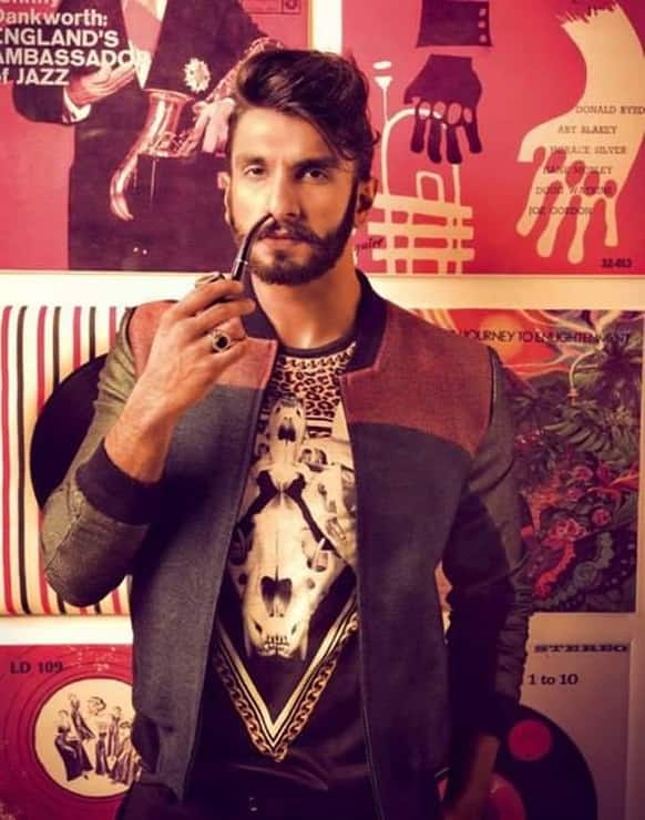 Ranveer Singh holding a pipe while posing for the cameras. (Pic courtesy: GQ India magazine)