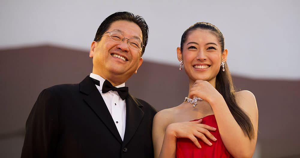 Actress Miori Takimoto, right, arrives with Studio Ghibli President Koji Hoshino for the screening of the movie 'The Wind Rises' at the 70th edition of the Venice Film Festival.