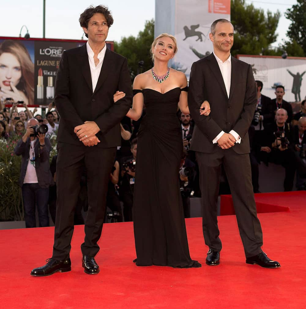 From left, director Jonathan Glazer, actress Scarlett Johansson and producer James Wilson arrive on the red carpet for the screening of the film Under The Skin at the 70th edition of the Venice Film Festival.