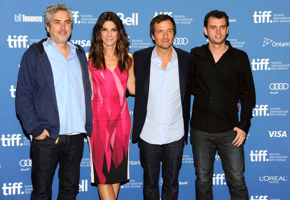 Director Alfonso Cuaron, actress Sandra Bullock, producer David Heyman and screenwriter Jonas Cuaron attend the press conference for 