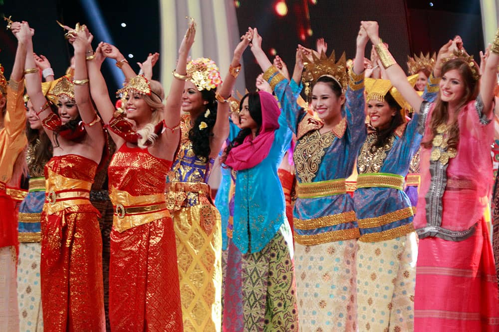 Miss World Pageant contestants wear Indonesian's traditional dress as they perform on stage during the opening of Miss World Pageant ceremony in Nusa Dua, Bali, Indonesia.