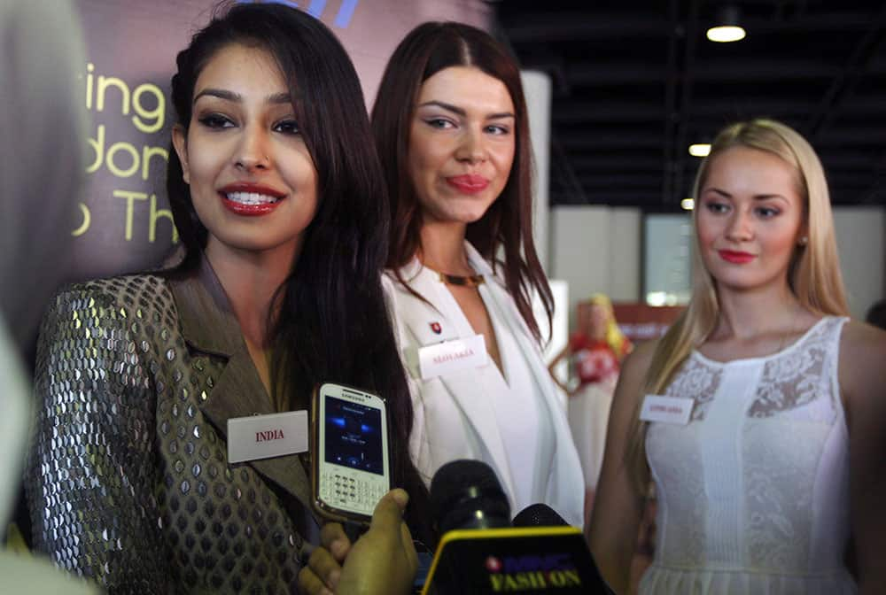 Miss World Pageant contestants, from left, Miss India Navneet Dhillon, Miss Slovakia Karolina Chomistekova and Miss Lithuania Ruta Elizbieta Mazureviciute, talk to reporters in Nusa Dua, Bali, Indonesia.