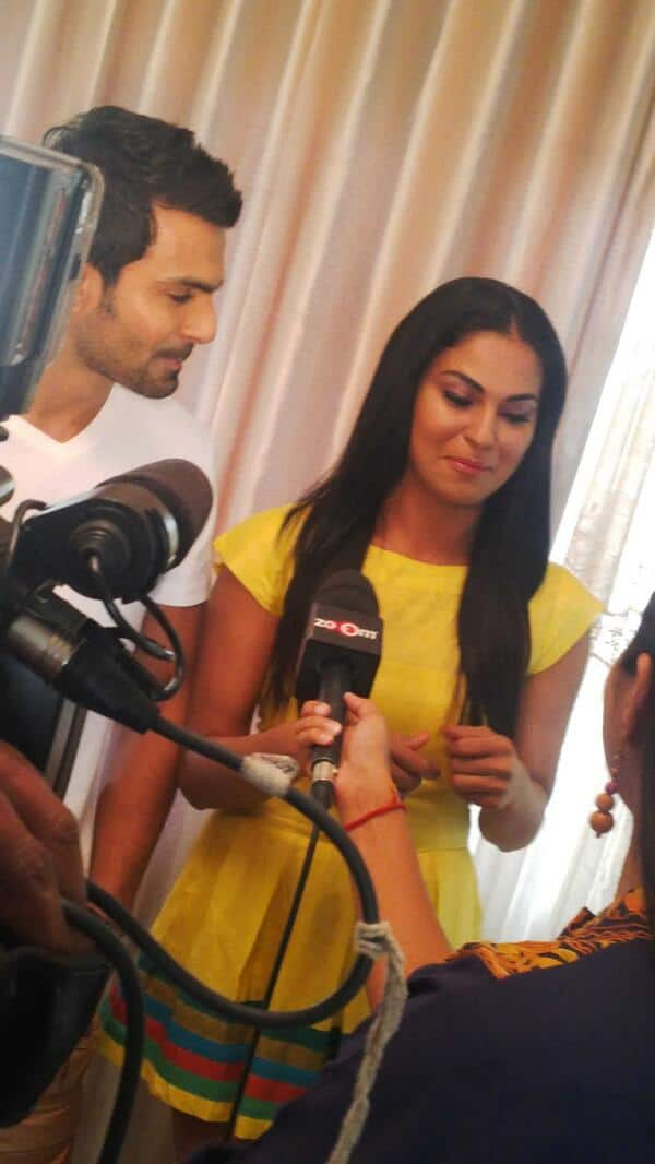 Veena Malik talking to the media persons with her ex-beau Ashmit Patel by her side.