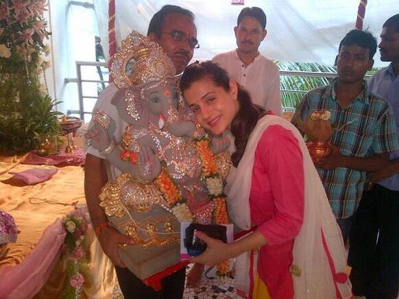 Ameesha Patel hugs her Ganpati.