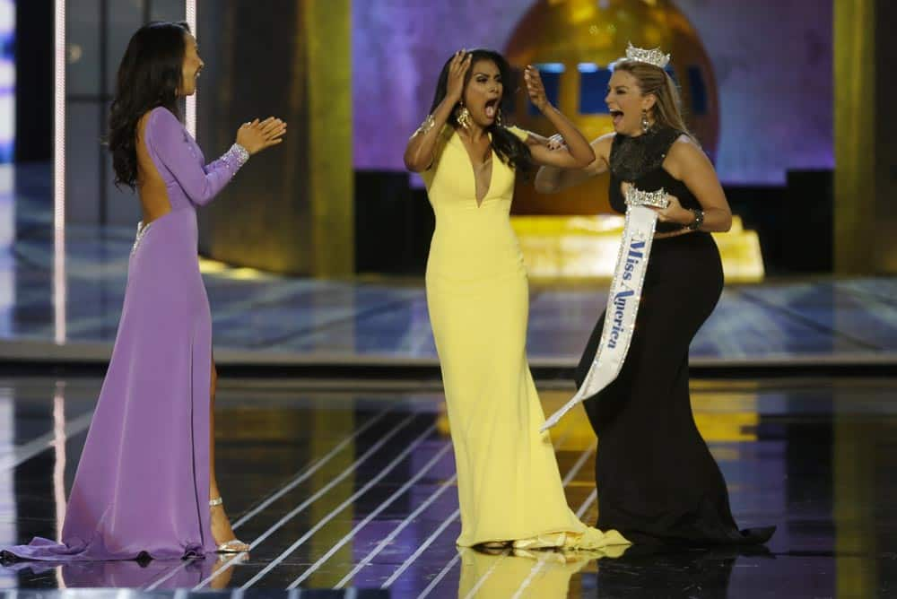 Miss New York Nina Davuluri, reacts after being named Miss America 2014 pageant as Miss California Crystal Lee and Miss America 2013 Mallory Hagan celebrate with her, in Atlantic City.