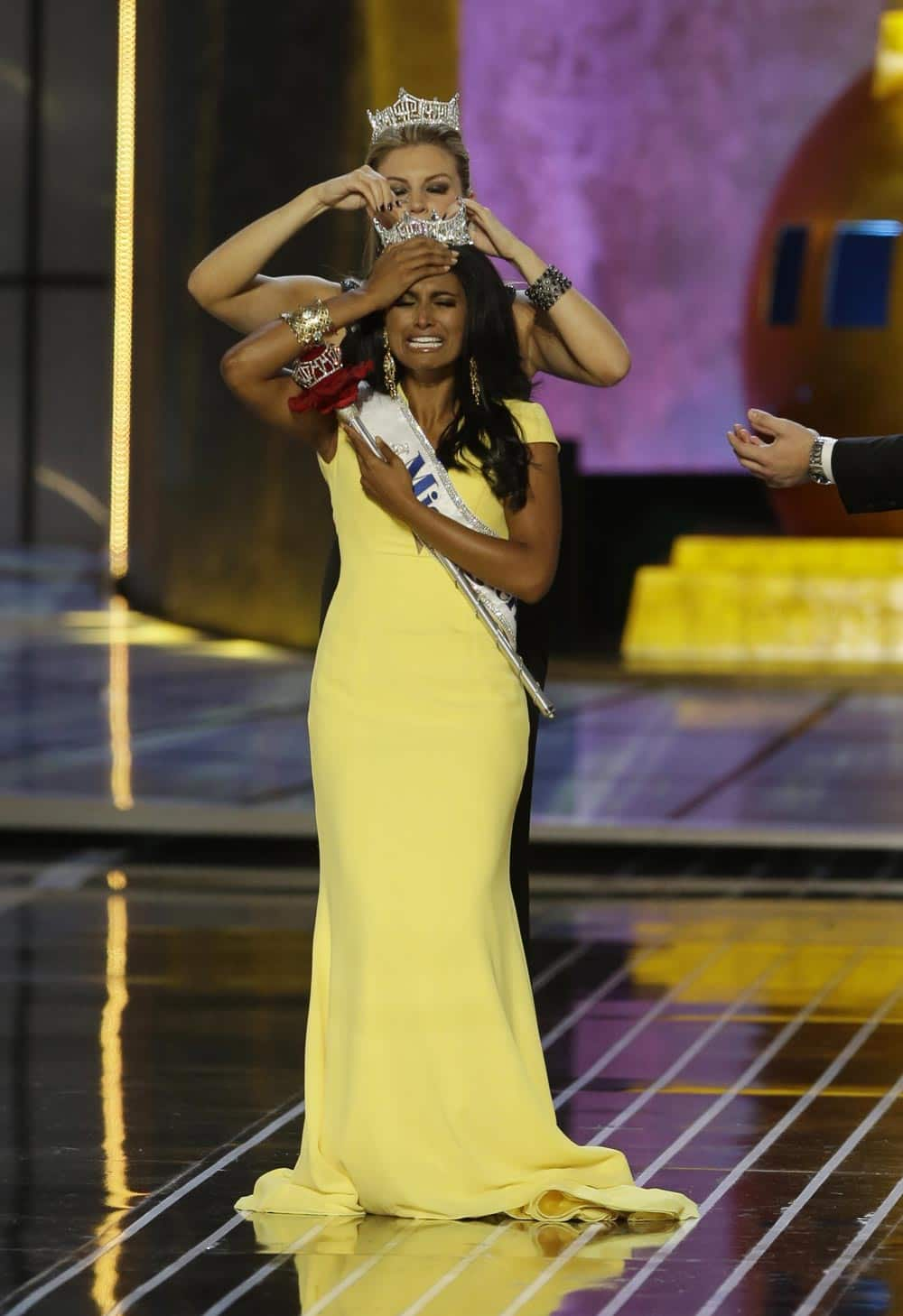 Miss New York Nina Davuluri, is crowned as Miss America 2014 by Miss America 2013 Mallory Hagan, in Atlantic City.