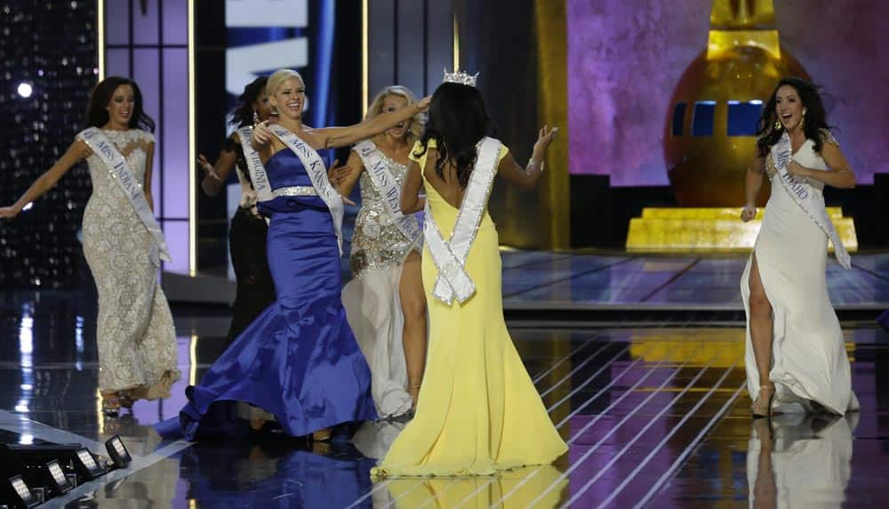 Miss New York Nina Davuluri, is approached by contestants after Davuluri was crowned as Miss America 2014, in Atlantic City.