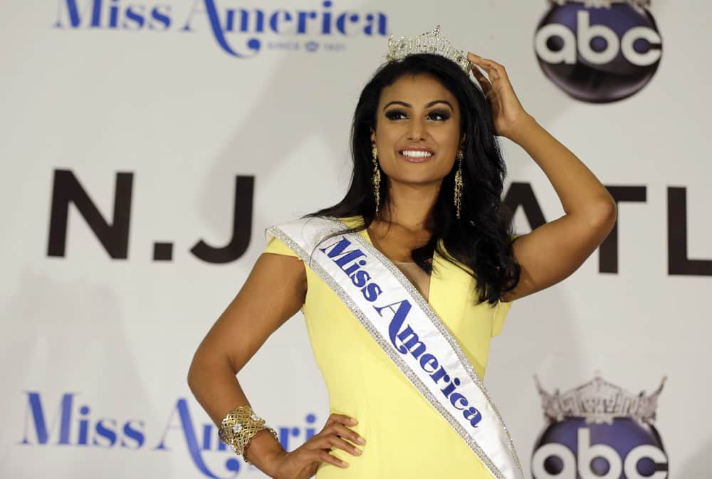 Miss New York Nina Davuluri poses for photographers following her crowning as Miss America 2014, in Atlantic City.