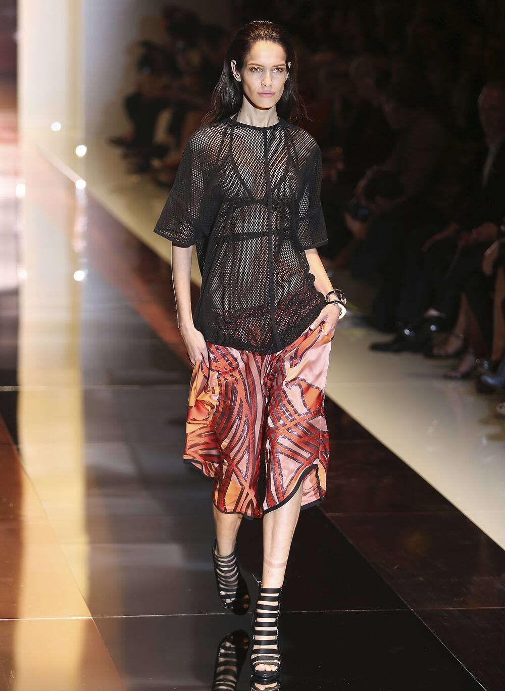 A model wears a creation for Gucci women's Spring-Summer 2014 collection, part of the Milan Fashion Week.