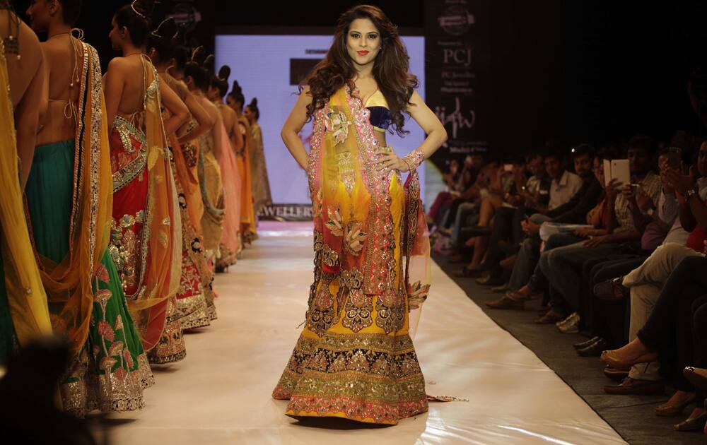 A model displays a creation by designer Mohit Falod during the India Jewellery and Fashion Week in Ahmadabad.