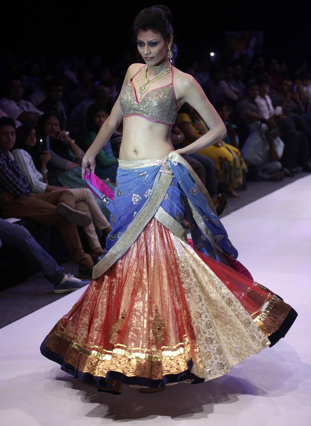 A model displays creations by NS Jewels and Sharad Raghav during the India Jewellery and Fashion Week (IJFW) in Ahmadabad.