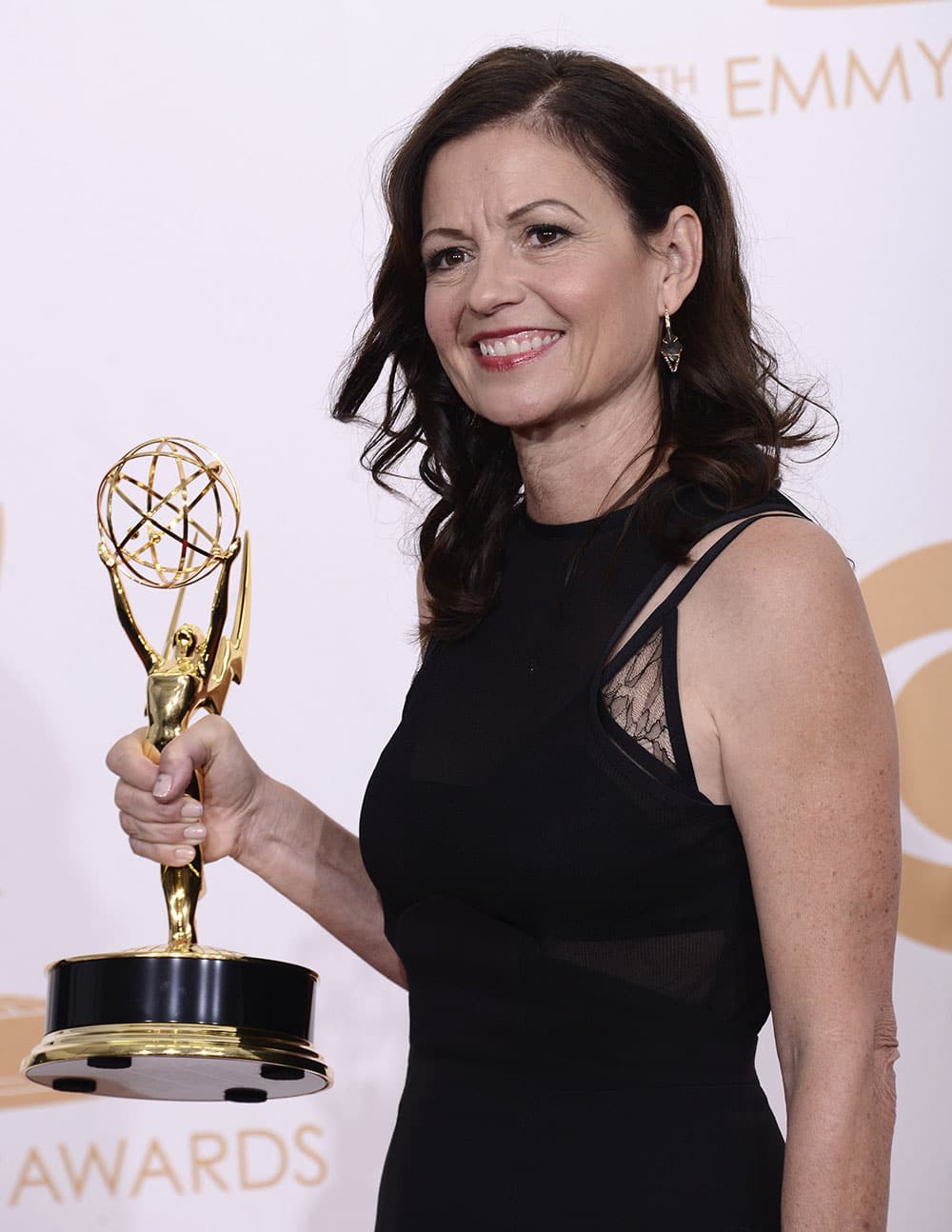 Director Gail Mancuso, winner of the best directing for a comedy series for 'Modern Family' poses backstage at the 65th Primetime Emmy Awards at Nokia Theatre.