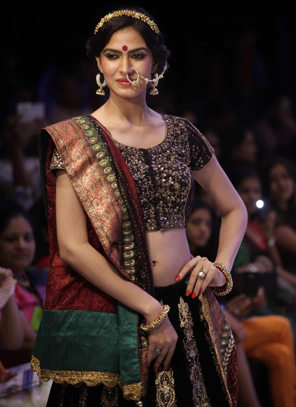 A model displays a creation by Palak's Couture during India Jewelery and Fashion Week in Ahmedabad.