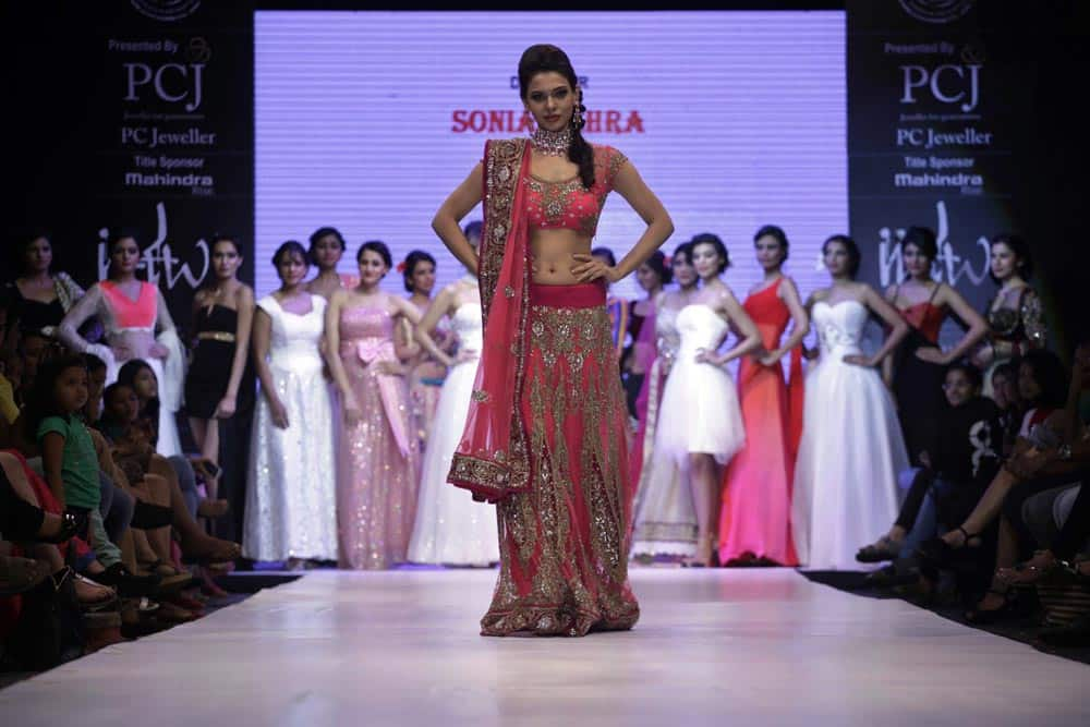 Models display creations by Sonia Mehra during the India Jewelry and Fashion Week in Ahmedabad.