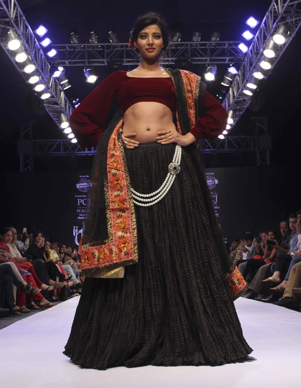 A model displays a creation by Sonia Mehra during the India Jewelry and Fashion Week in Ahmedabad.