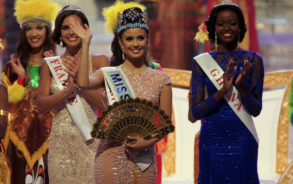 Newly crowned Miss World Megan Young of Philippine waves after winning the Miss World contest, in Nusa Dua, Bali, Indonesia.