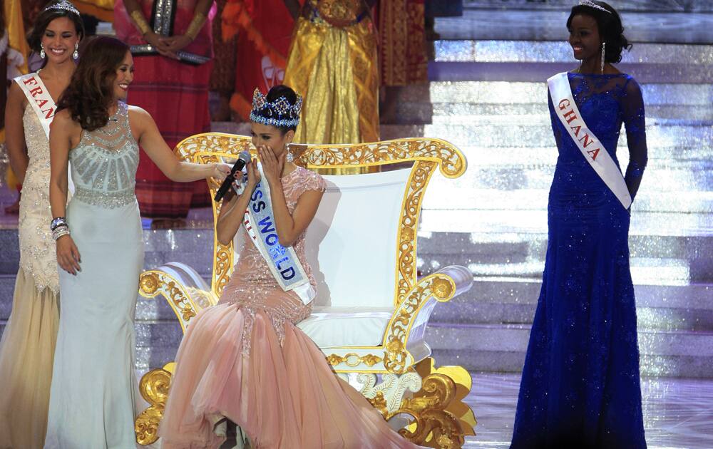 Newly crowned Miss World, Megan Young of the Philippines, center, reacts after winning the Miss World contest, in Nusa Dua, Bali, Indonesia.