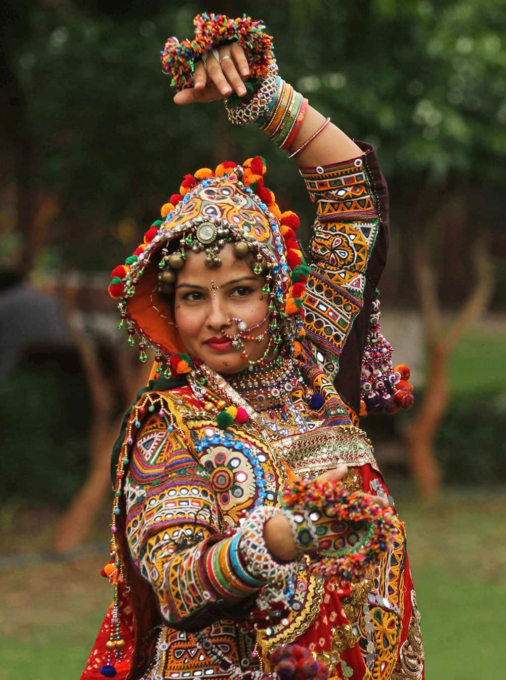 A woman dressed in traditional finery practices the Garba dance, ahead of the Navratri festival in Ahmadabad.