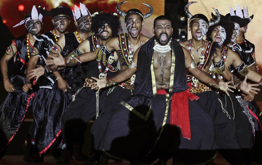 Artists dressed in traditional attire rehearse for the inauguration of Navratri festival in Ahmadabad.