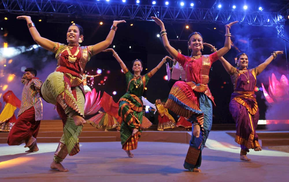 Artists dressed in traditional attire rehearse for the inauguration function of Navratri festival in Ahmadabad.