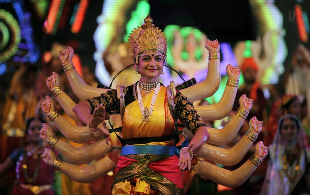 A artist performs during the grand rehearsal for Navratri celebrations in Ahmadabad.