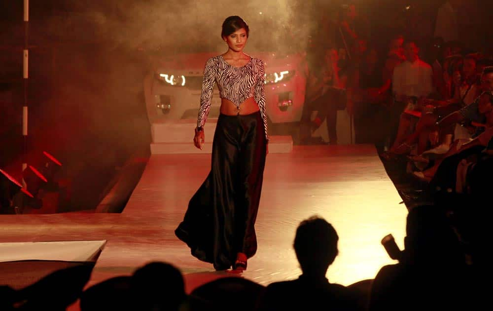 A Sri Lankan model displays a creation by designer Indi during the Colombo Fashion Week's resort wear leg in Galle, Sri Lanka.