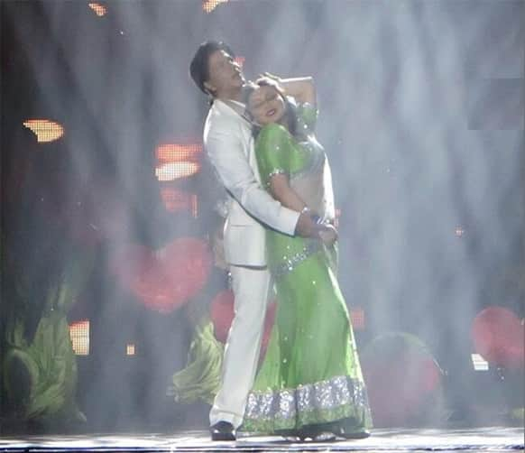 Shah Rukh and Rani in a romantic embrace while performing on stage during the Temptation event in Australia.