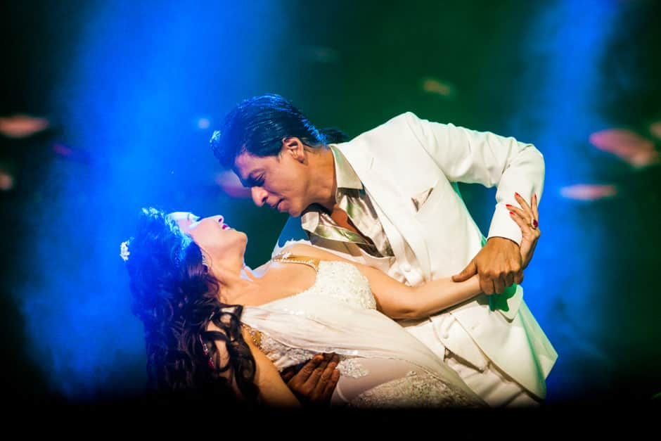 Shah Rukh Khan romances Madhuri Dixit during a performance at the TEMPTATIONS RELOADED 2013 event in Sydney. 