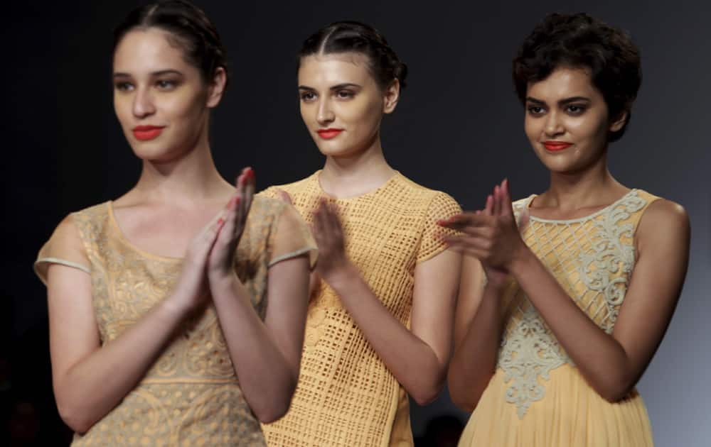 Models display creations by Manish Gupta during the Wills lifestyle Fashion Week in New Delhi.