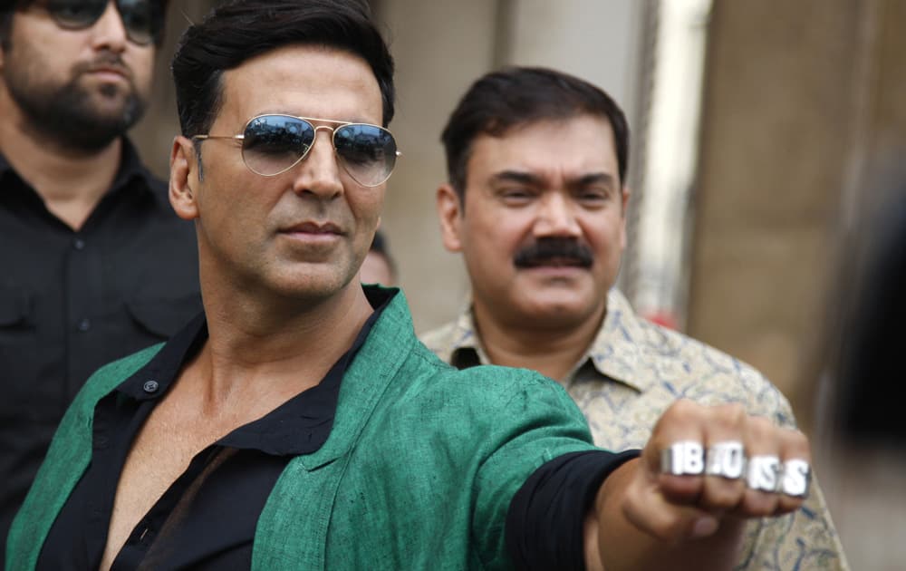 Akshay Kumar shows his rings during a promotional event of his upcoming movie 