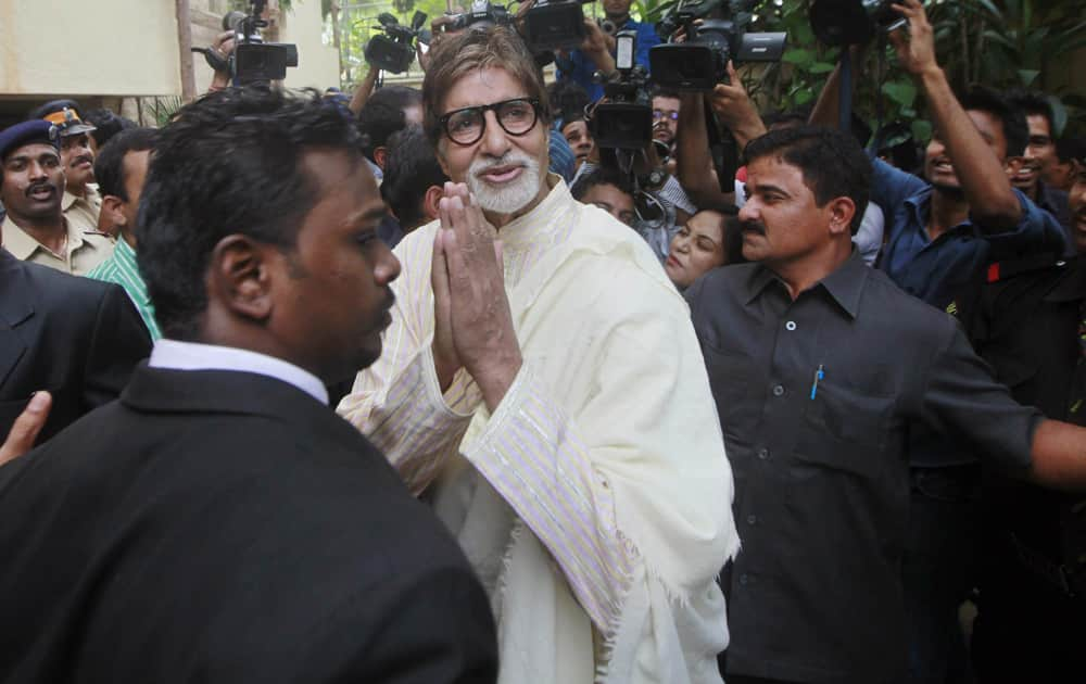 Amitabh Bachchan greets his fans outside his residence on his 71st birthday in Mumbai.