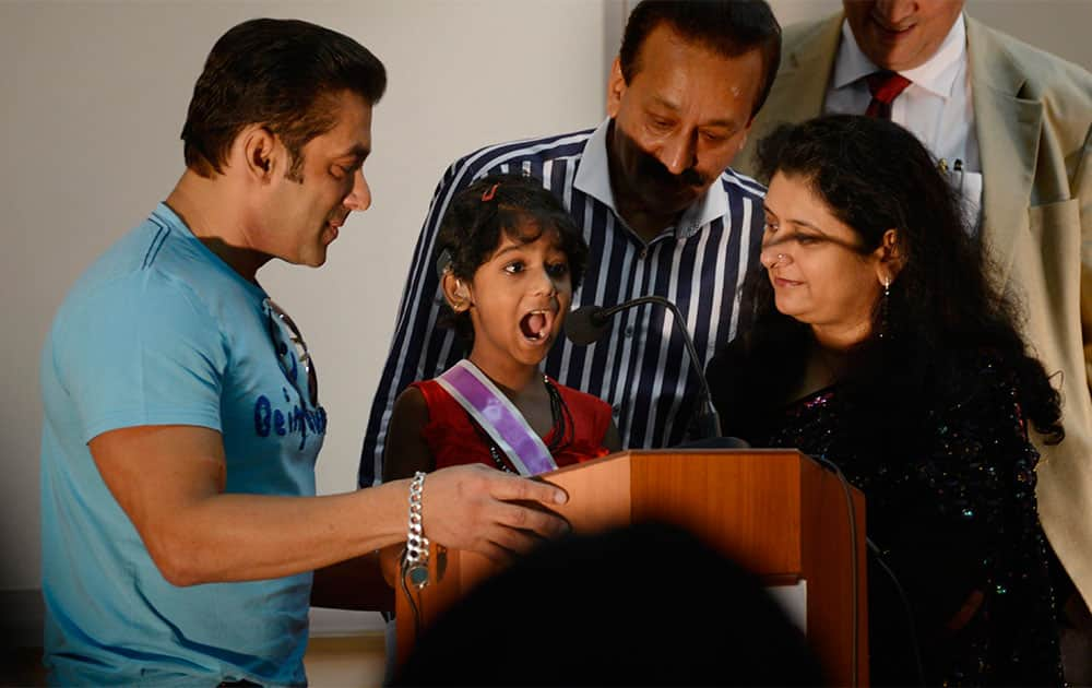 Bollywood actor Salman Khan (L) poses with the children during the second anniversary celebration of Cochlear implants facility for underprivileged children at Holy family hospital in Mumbai. Pic Courtesy: DNA