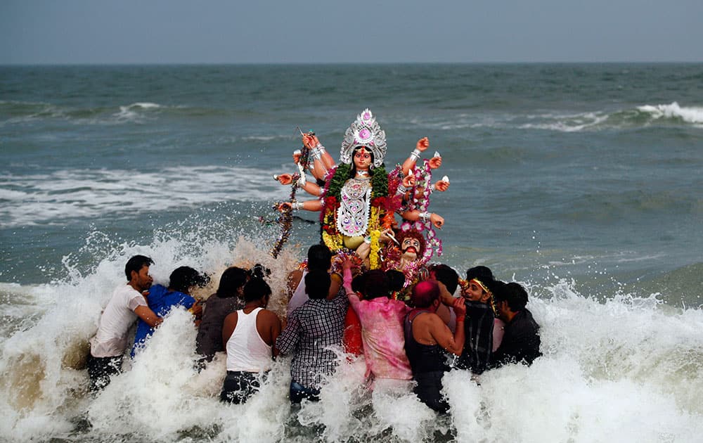 Indian devotees carry an idol of Hindu goddess Durga to be immersed in the Bay of Bengal marking the end of Durga Puja festivities in Chennai.