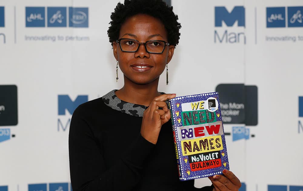 Zimbabwean author NoViolet Bulawayo poses with her book 'We Need New Names' during a photocall for the shortlisted authors of the 2013 Man Booker Prize for Fiction at the Queen Elizabeth Hall in London.