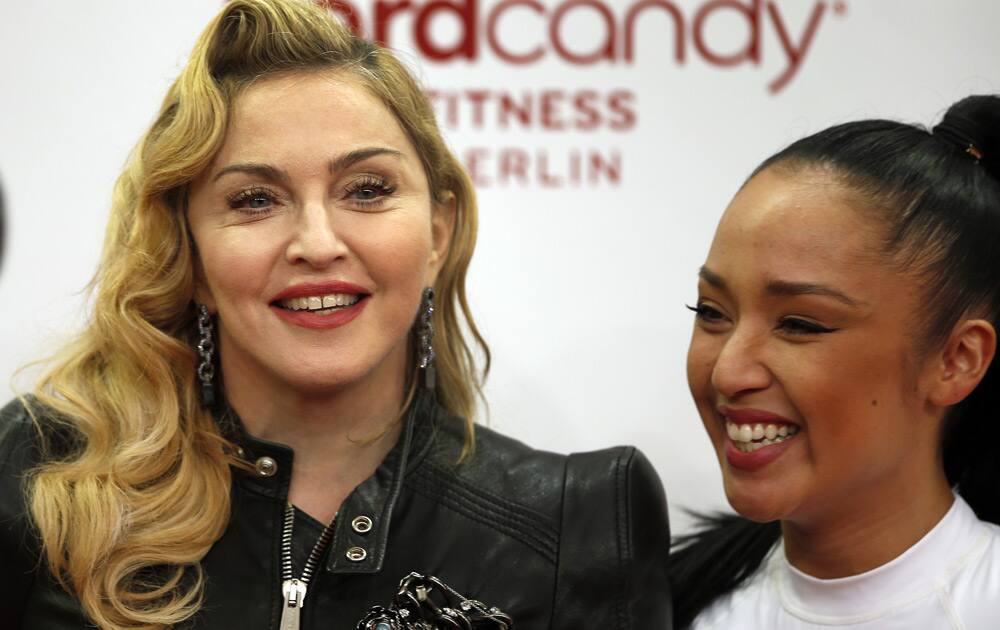 US pop star Madonna and her personal trainer Nicole Winhoffer pose for the media during Madonna's visit at the 